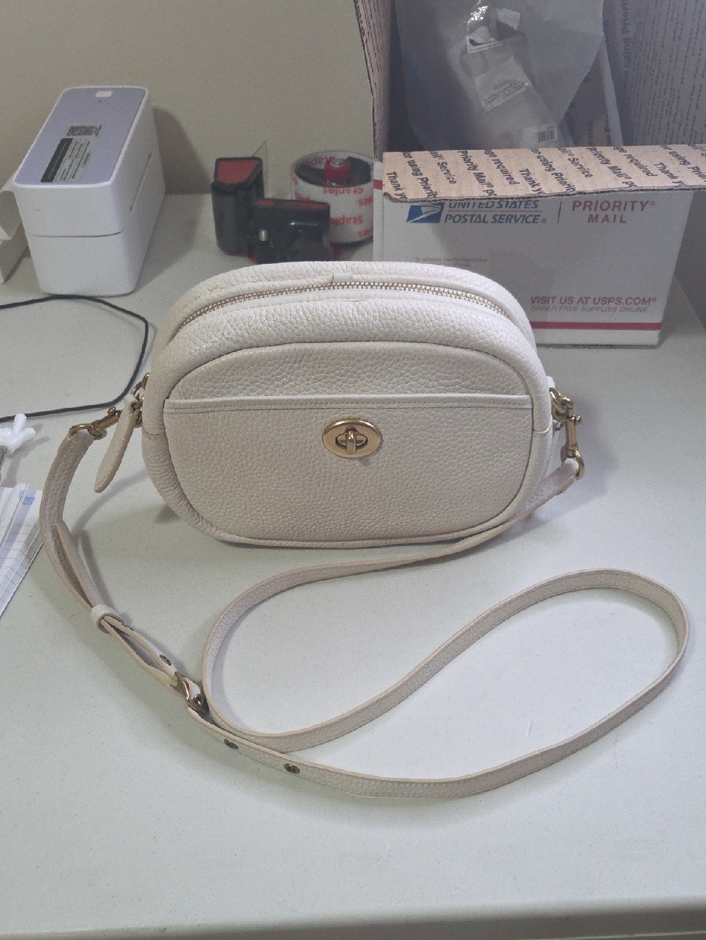 Coach Camera Cream Crossbody Bag with Turn-Lock Closure